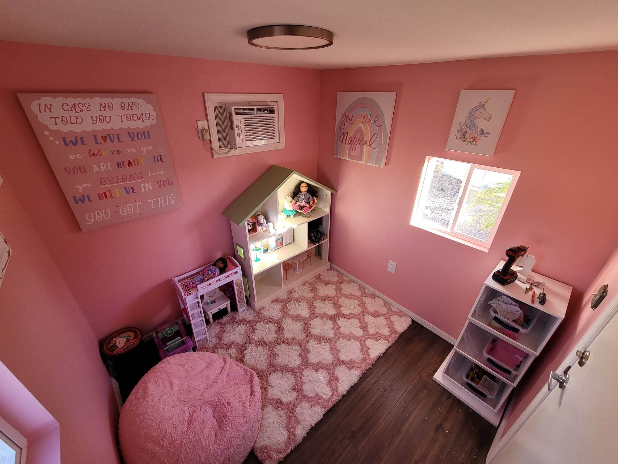 Completed bedroom addition with painted walls and wood flooring