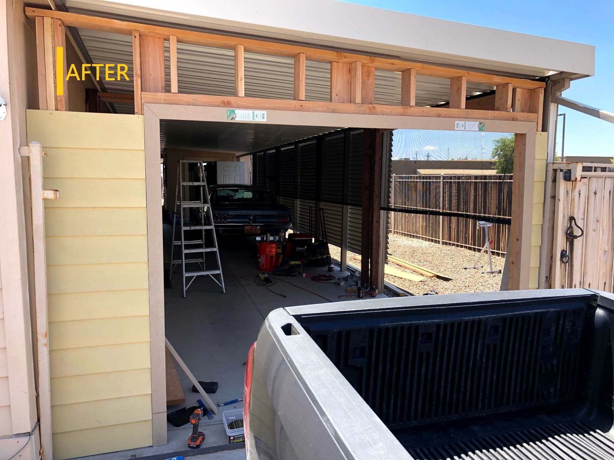 Finished enclosed garage with wood-look overhead door and stucco exterior