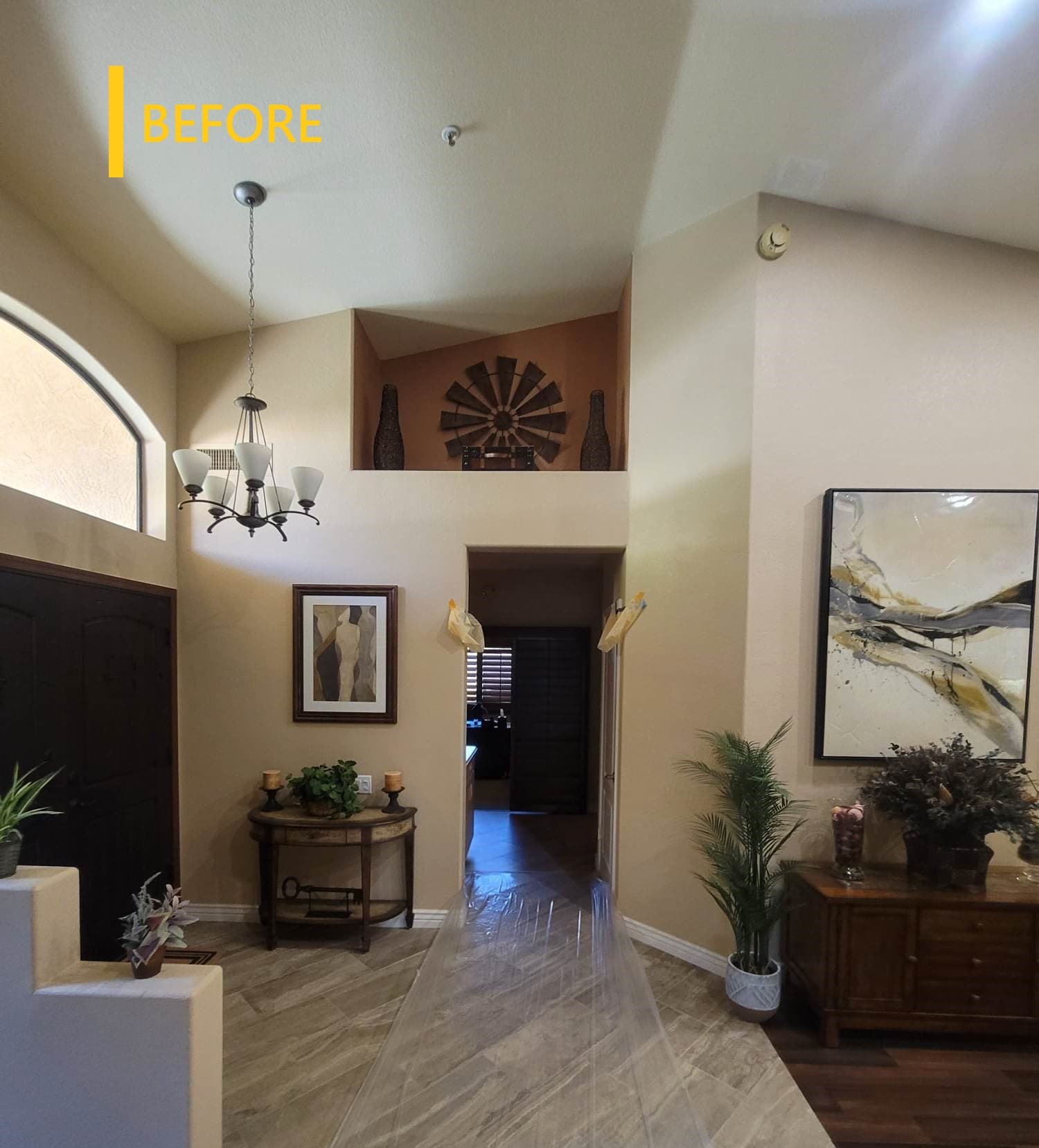 Arched interior opening with chandelier in the finished home